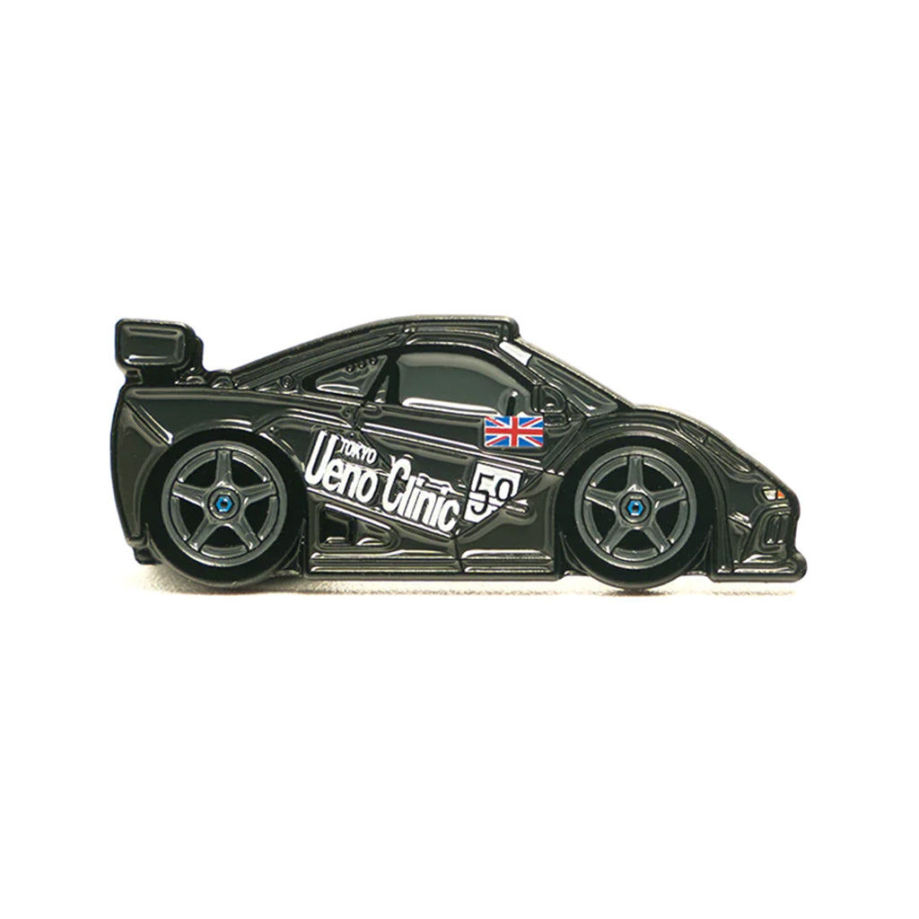 Soft enamel lapel pin of a Mclaren F1 with the iconic UENO livery