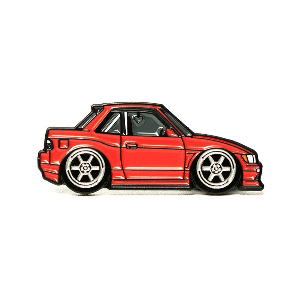 Soft enamel lapel pin of a red Nissan S13