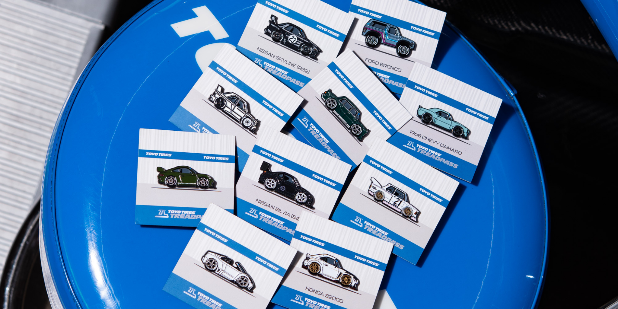 an image of two new arrival pins, featuring Madmike's McLaren P1 and Miata MX5