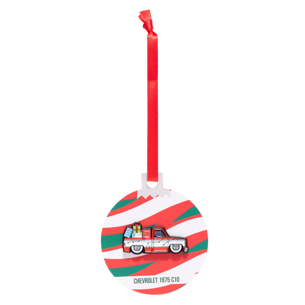 Decorative ornament with a red and green striped design featuring a vintage Chevrolet 1975 C10 truck, on a white background.