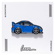 Metal enamel pin of an '05 DC5 RSX in blue with white six spoke wheels. On white open edition backing card with Leen logo.
