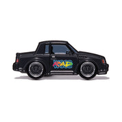 Metal enamel pin of a Buick Regal GNX in black on black mesh wheels with Radwood logo on passenger door.