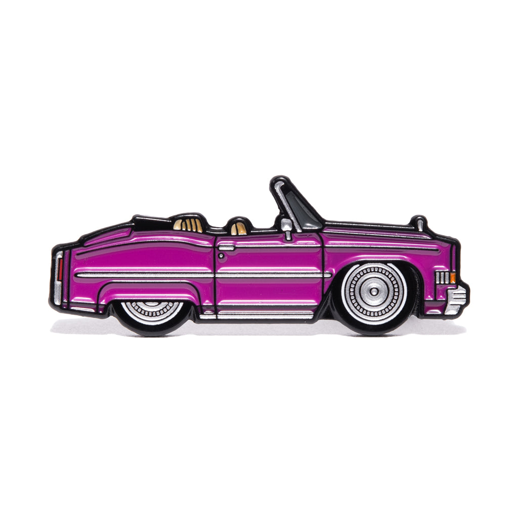 Metal enamel pin of a purple convertible Cadillac with silver wheels. Inspired by the film "True Romance".