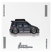 Metal enamel pin of an EF Wagon in grey with silver wheels and roof rack. On white open edition backing card with Leen logo.