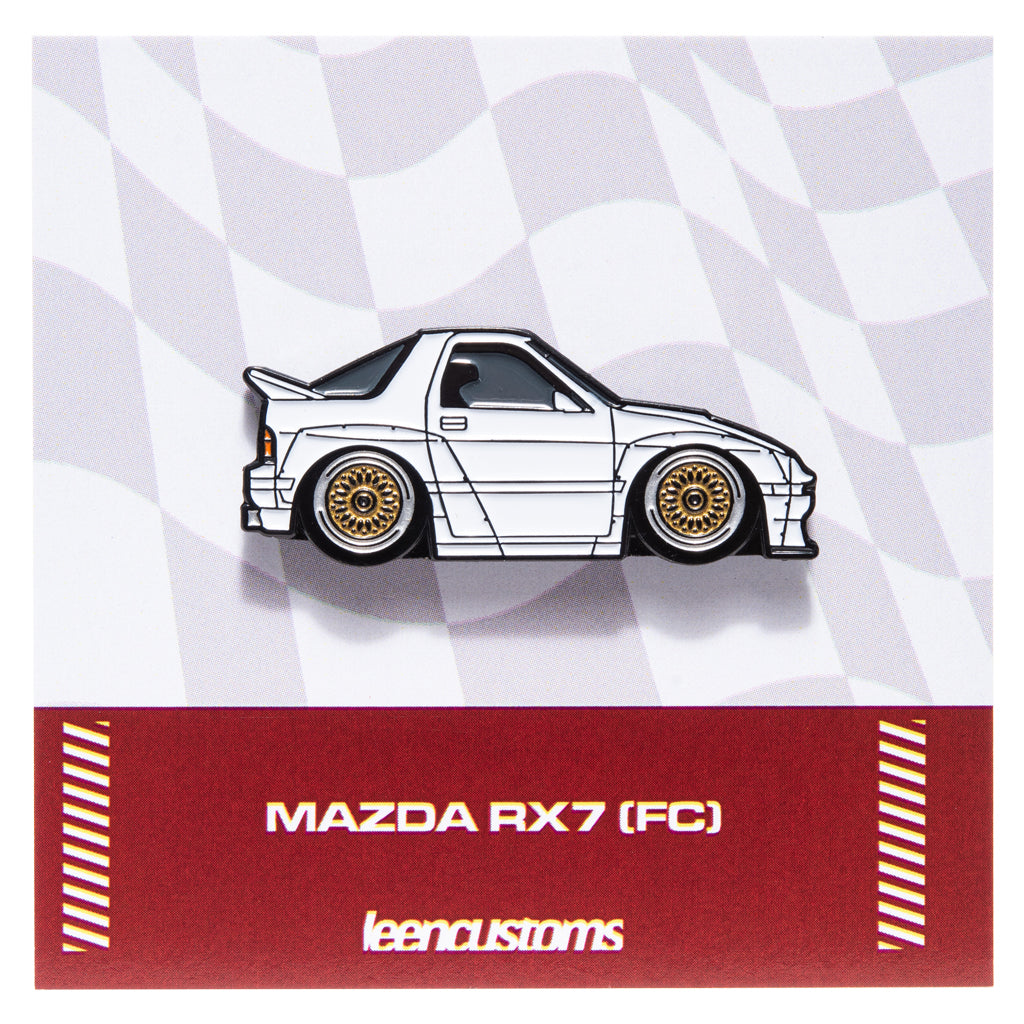 Enamel pin of a white Mazda RX7 (FC) design on a checkered background