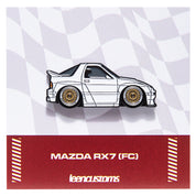 Enamel pin of a white Mazda RX7 (FC) design on a checkered background