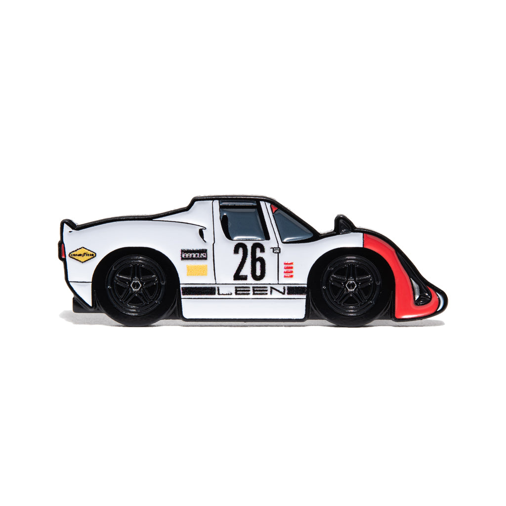 Limited edition air-cooled 910 sports car enamel pin with five-spoke black wheels, side profile with a #26. 