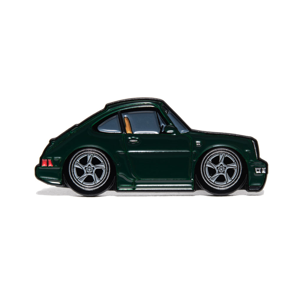 Limited edition dark green air-cooled 964 enamel pin with five-spoke wheels, side profile.