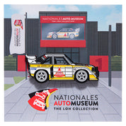 Enamel pin of Audi Sport Quattro S1 in front of Nationales Auto Museum backing card