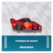 Red Porsche 935K car pin with red Momo inspired livery  and Leen Customs branding on a checkered background