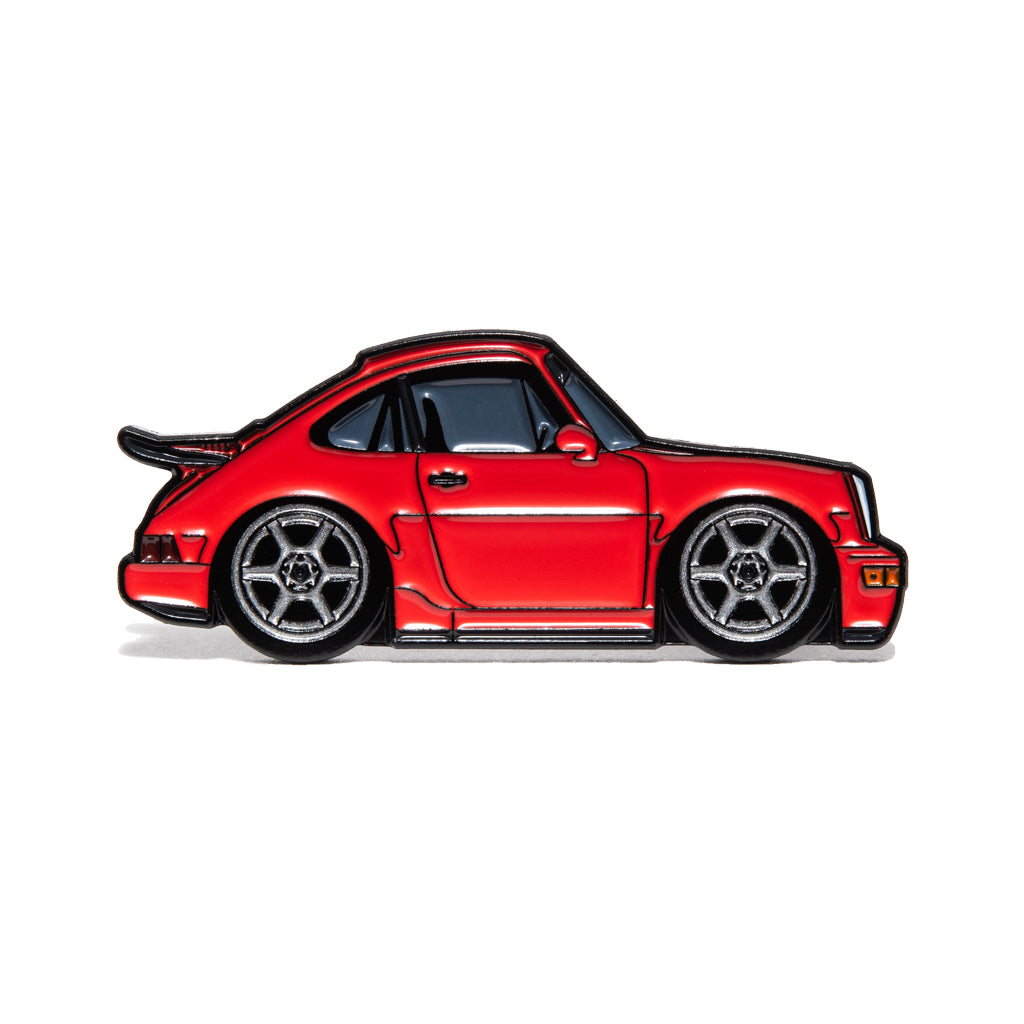 Red Porsche  964 RS sports car enamel pin with six-spoke wheels, side profile on white background.