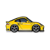 Yellow 996 generation sports car enamel pin with five-spoke wheels, side profile on white background.