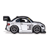 Enamel pin of a white BMW E92 with #11 on it. 