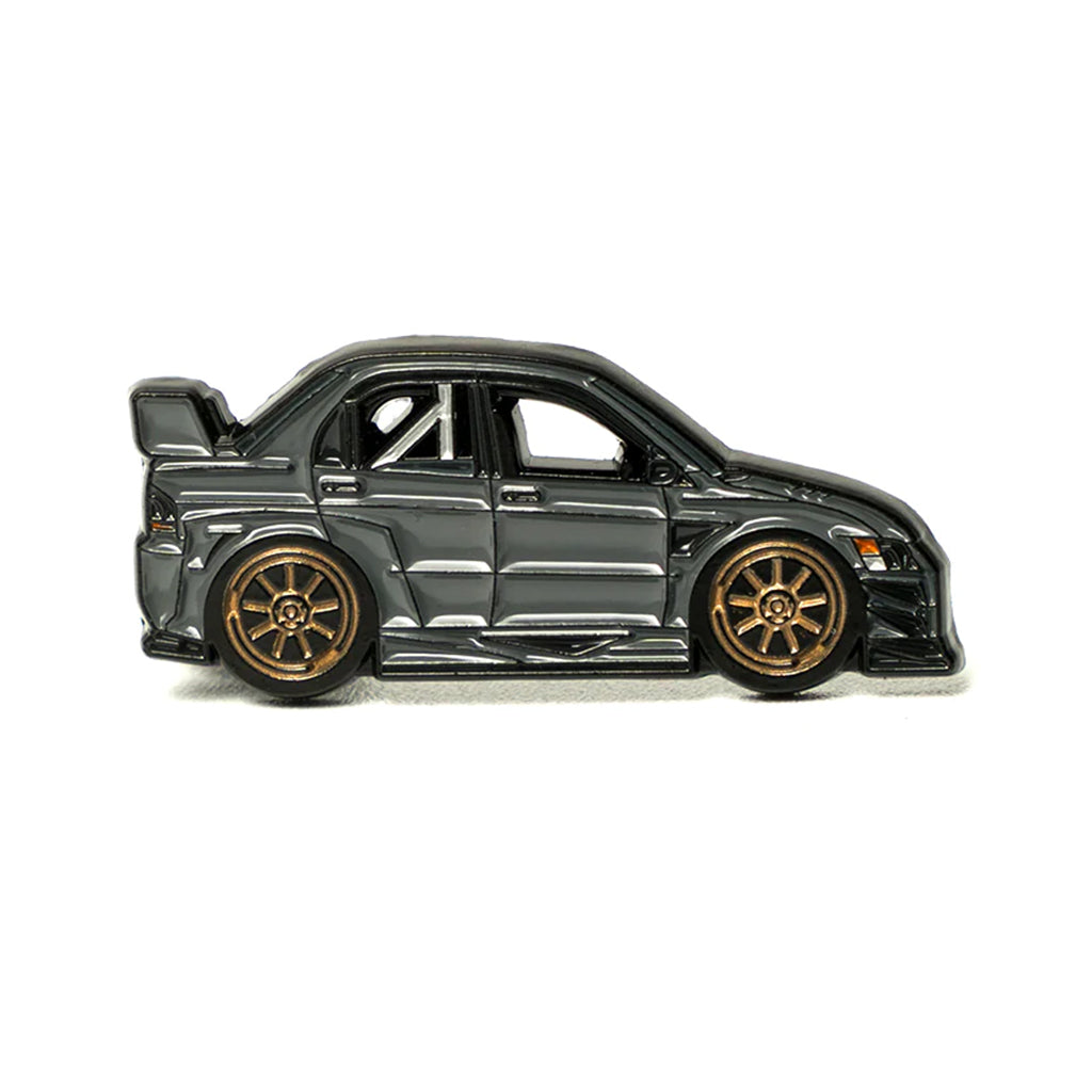 Soft enamel lapel pin of a charcoal grey Mitsubishi Evo 9