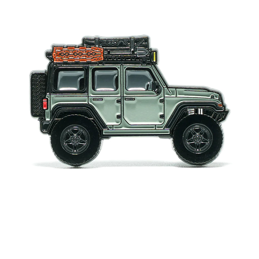 Soft enamel lapel pin of a olive mist colored Jeep Wrangler