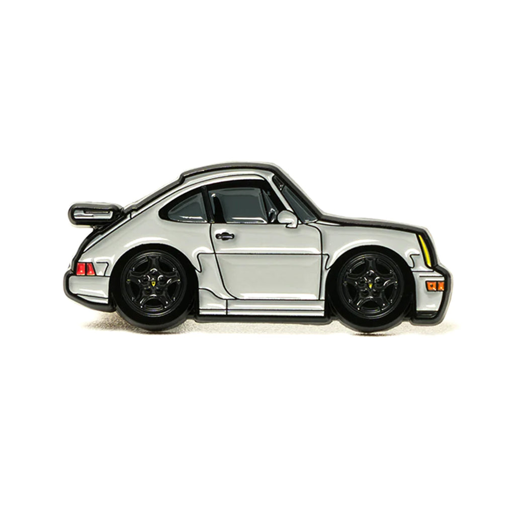 Soft enamel lapel pin of a grey 964 Porsche