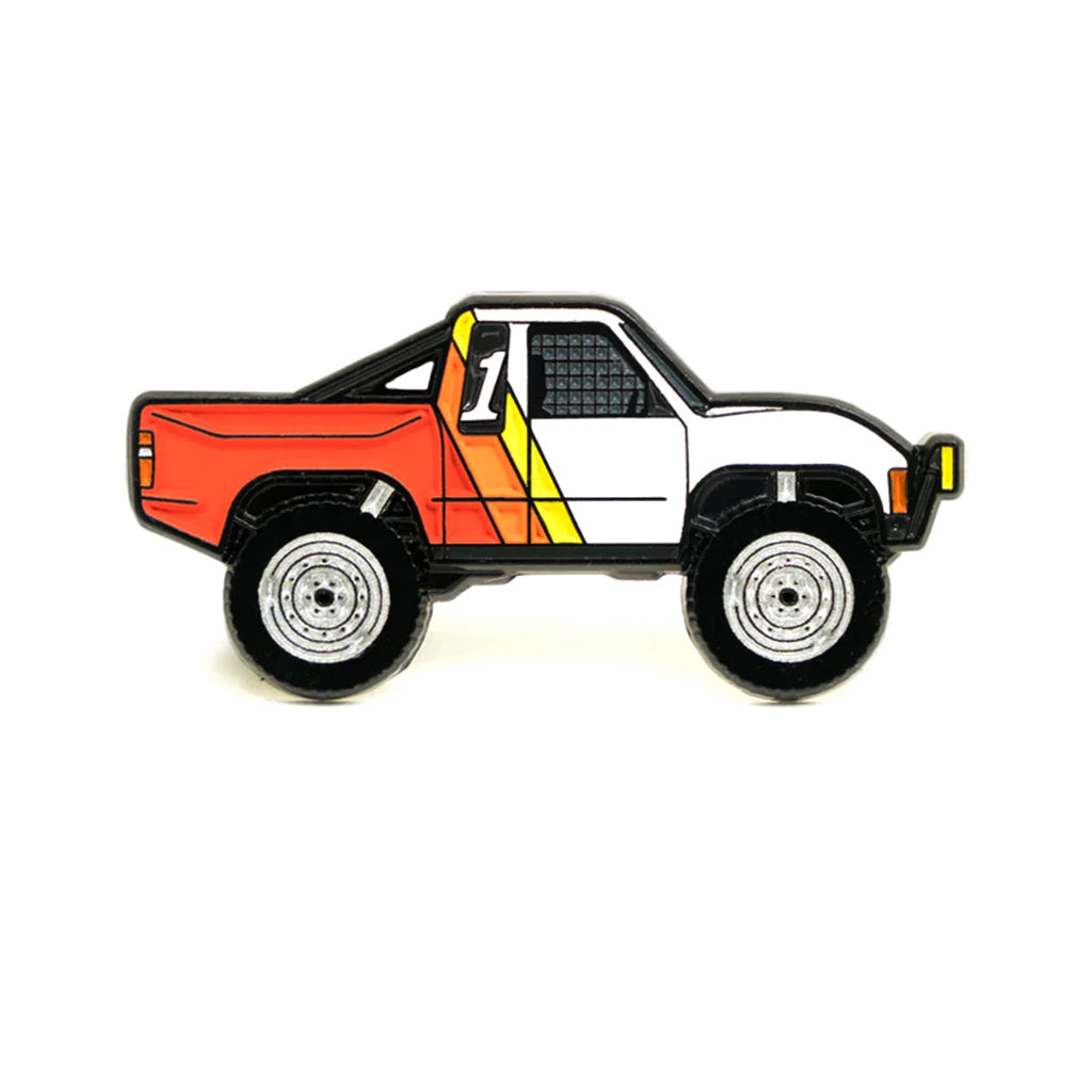 Soft enamel lapel pin of a Baja inspired Toyota truck