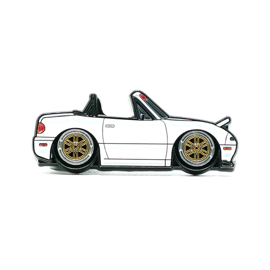 Soft enamel lapel pin of a white Mazda Miata MX-5