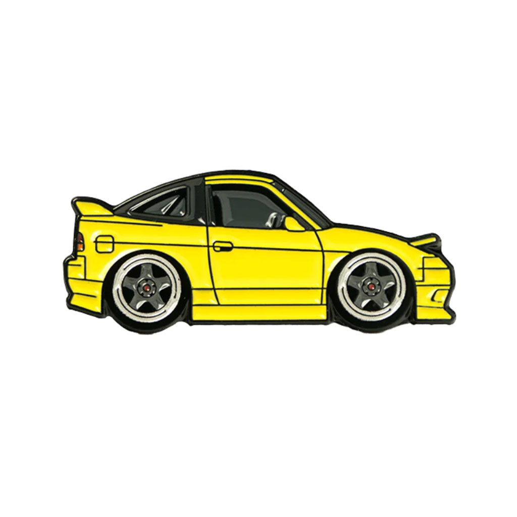 Soft enamel lapel pin of a yellow Nissan 240sx