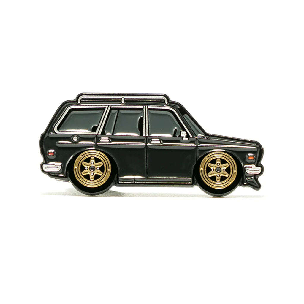 A soft enamel lapel pin of a black Datsun 510 wagon