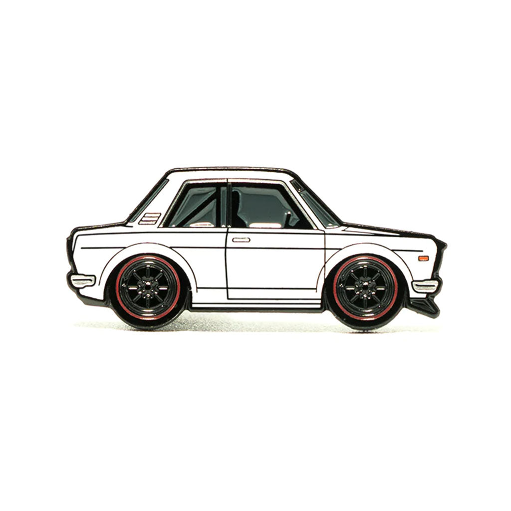 A soft enamel lapel pin of a white Datsun 510 coupe