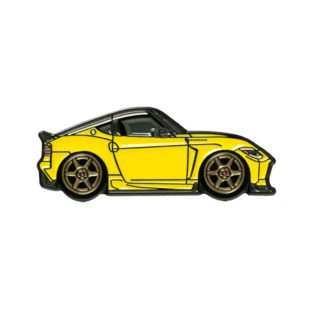 Soft enamel lapel pin of a yellow Nissan Z