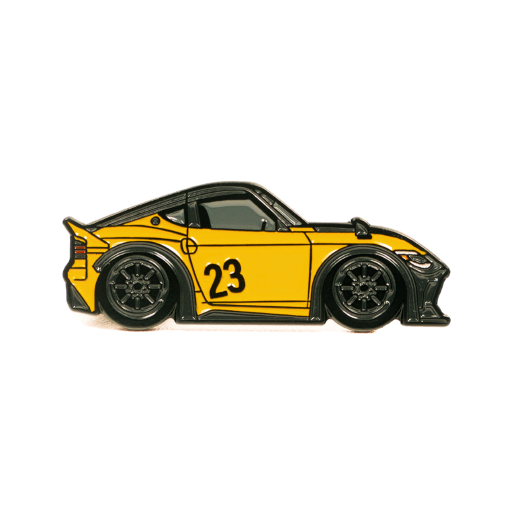 Soft enamel lapel pin of LBWK's inspired Nissan Z in orange