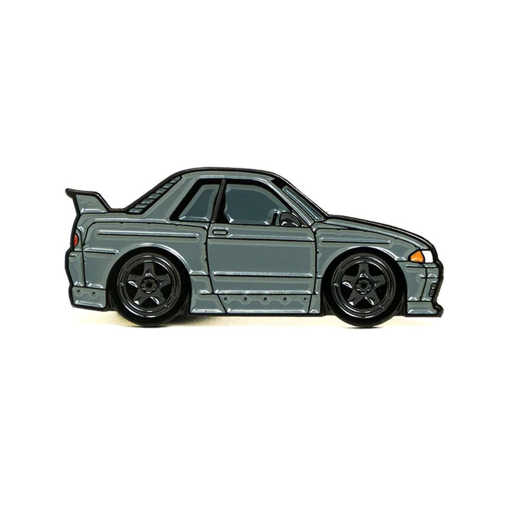 Soft enamel lapel pin of a charcoal Nissan Skyline R32