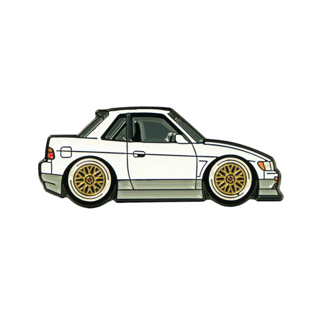 Soft enamel lapel pin of a two-toned white and grey Nissan S13
