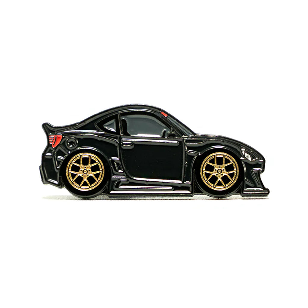 Soft enamel lapel pin of a black widebody BRZ