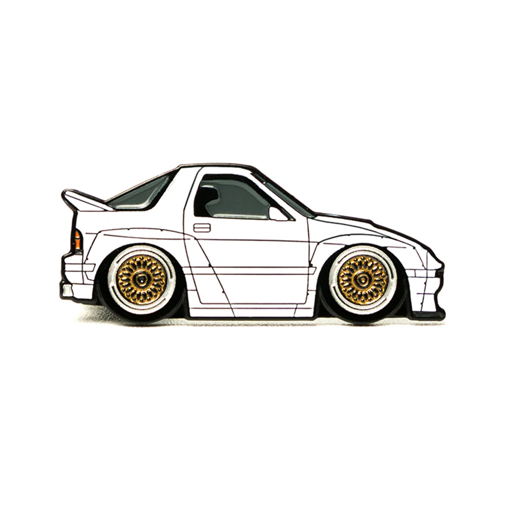 Soft enamel lapel pin of a white Mazda FC RX7