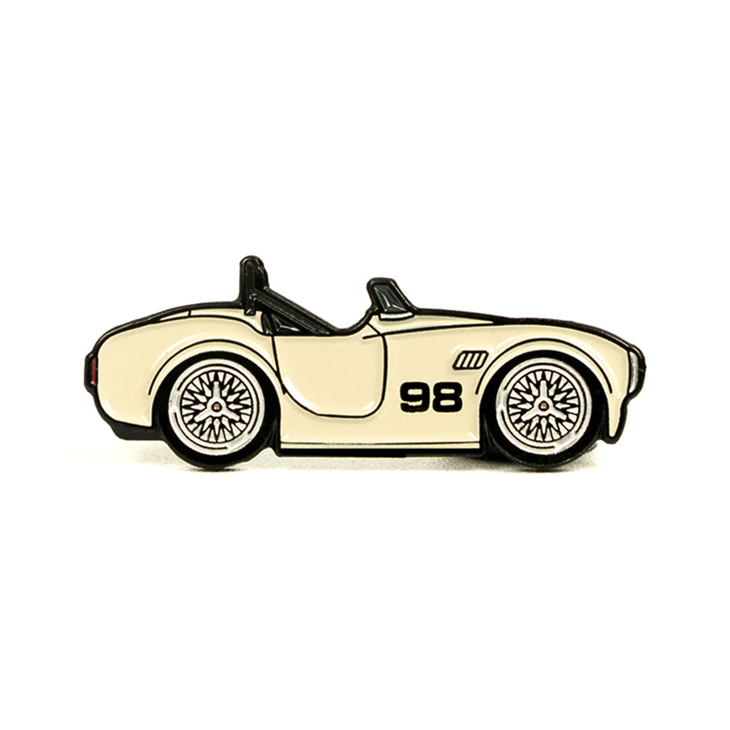 Soft enamel lapel pin of a Shelby 427 Cobra