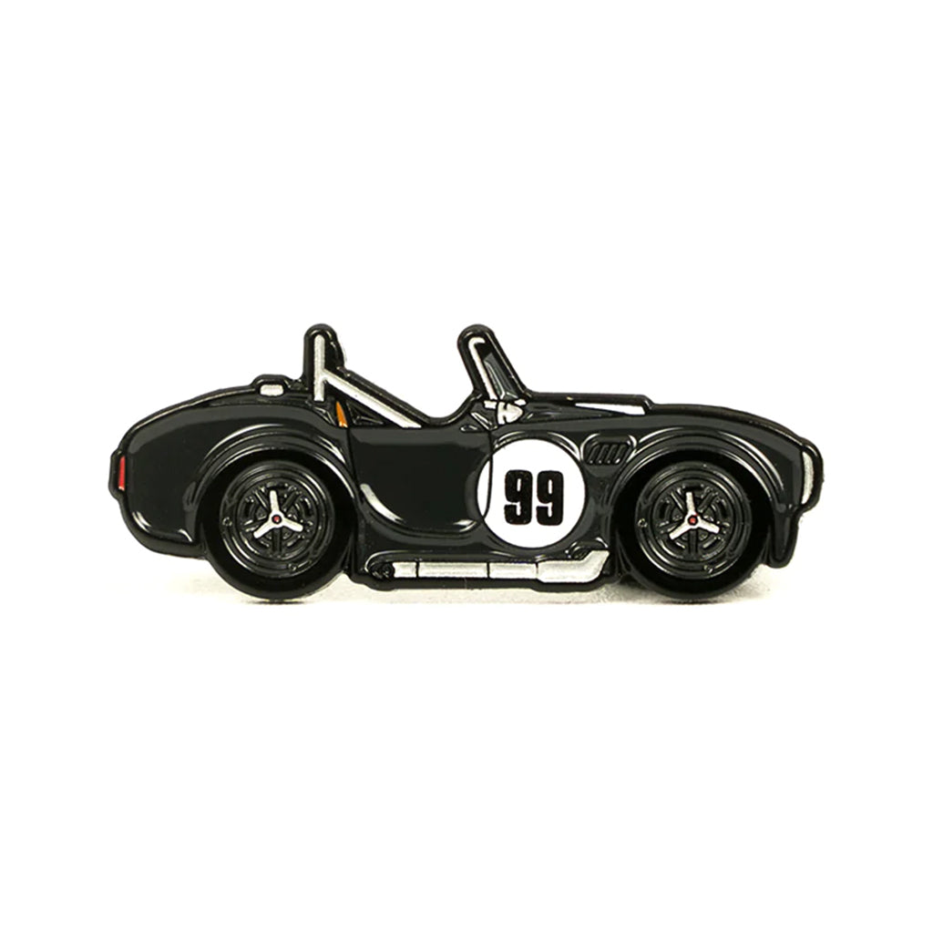 Soft enamel lapel pin of a black Shelby 289 Cobra