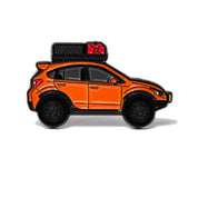 A soft enamel lapel pin of an orange Subaru Crosstrek