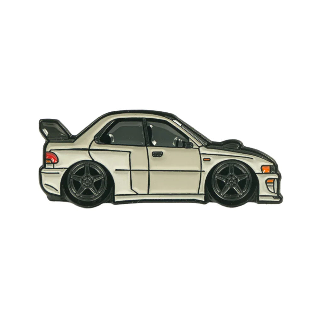 A soft enamel lapel pin of a wide body Subaru GC8