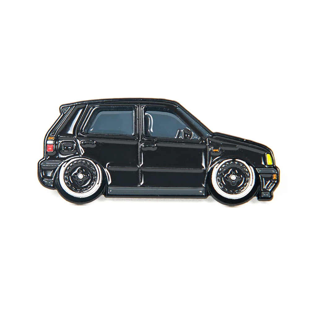 Soft enamel lapel pin of a black Volkswagen MK3 Golf