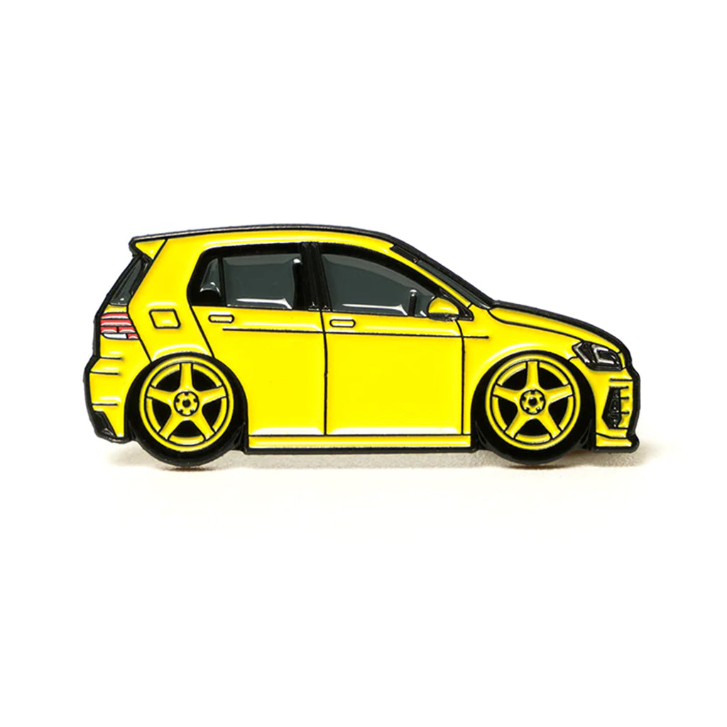 Soft enamel lapel pin of a yellow Volkswagen Golf MK7.5