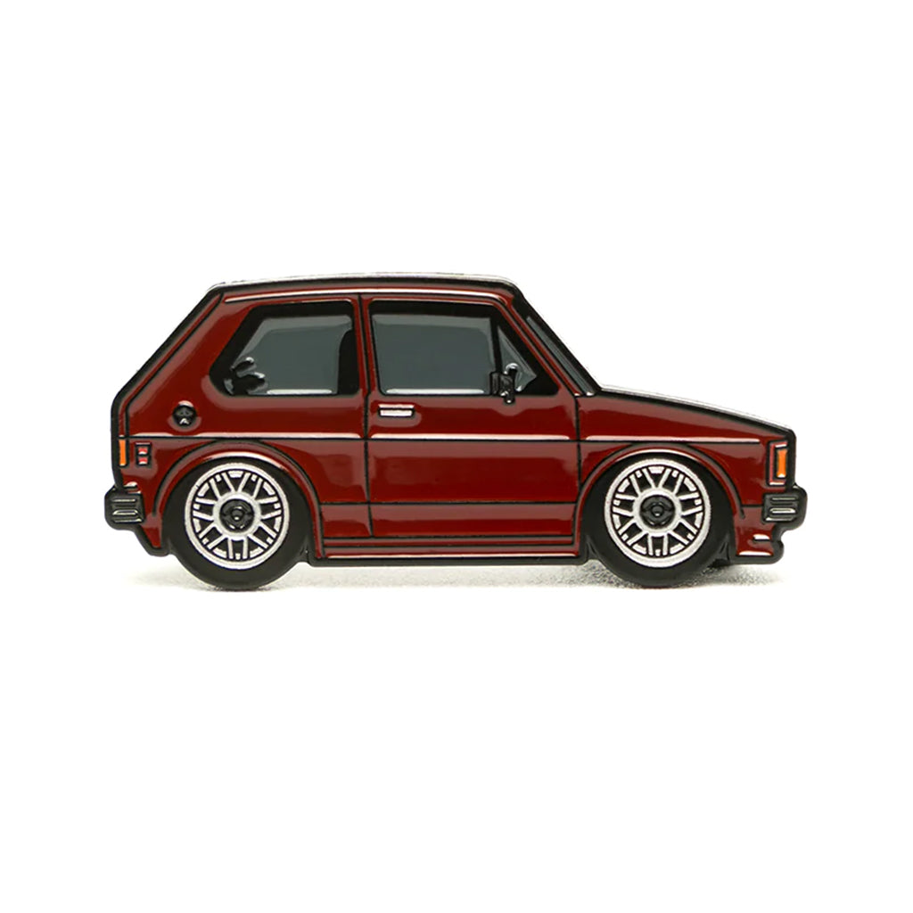 Soft enamel lapel pin of a burgundy Volkswagen Rabbit MK1