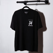LC "EB110 LM" Staple Tee