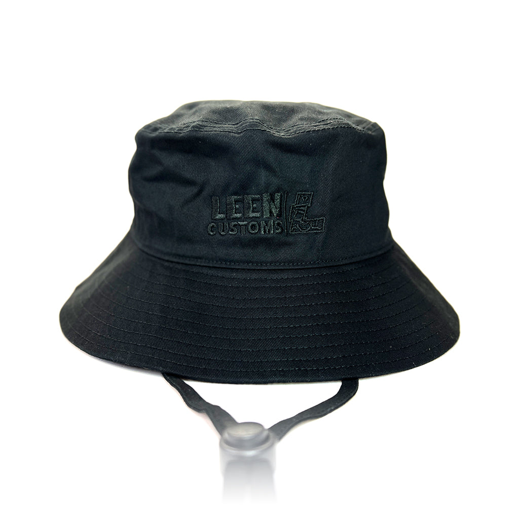 Black Leen Customs wide brim bucket hat with black embroidered logo detail.